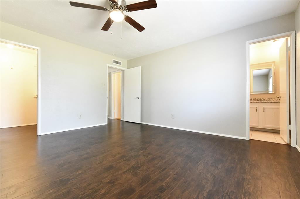 4113 Juneberry Street Fort Worth, TX 76137 - Photo 29 of 36 a view of an empty room with wooden floor and a window