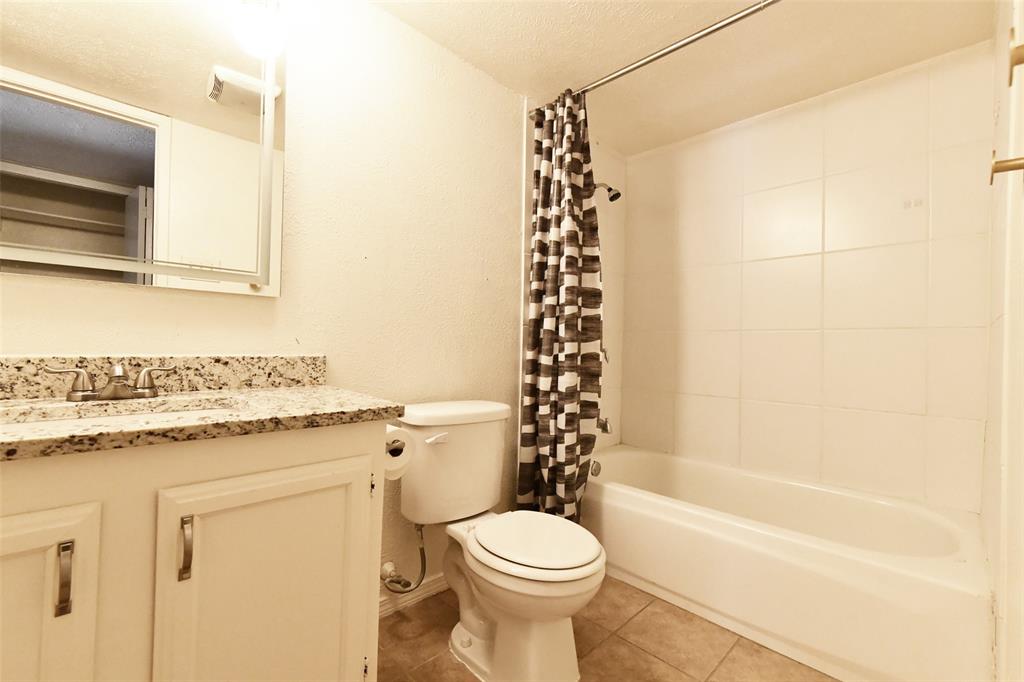 4113 Juneberry Street Fort Worth, TX 76137 - Photo 34 of 36 a bathroom with a sink toilet and shower