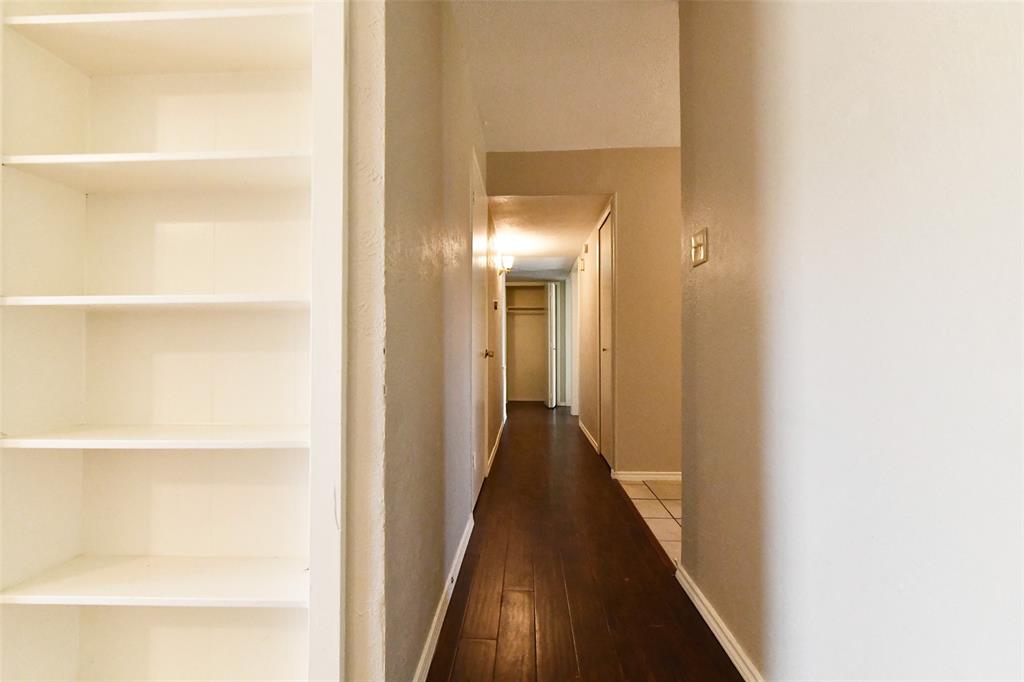 4113 Juneberry Street Fort Worth, TX 76137 - Photo 36 of 36 a view of a hallway with a wooden floor