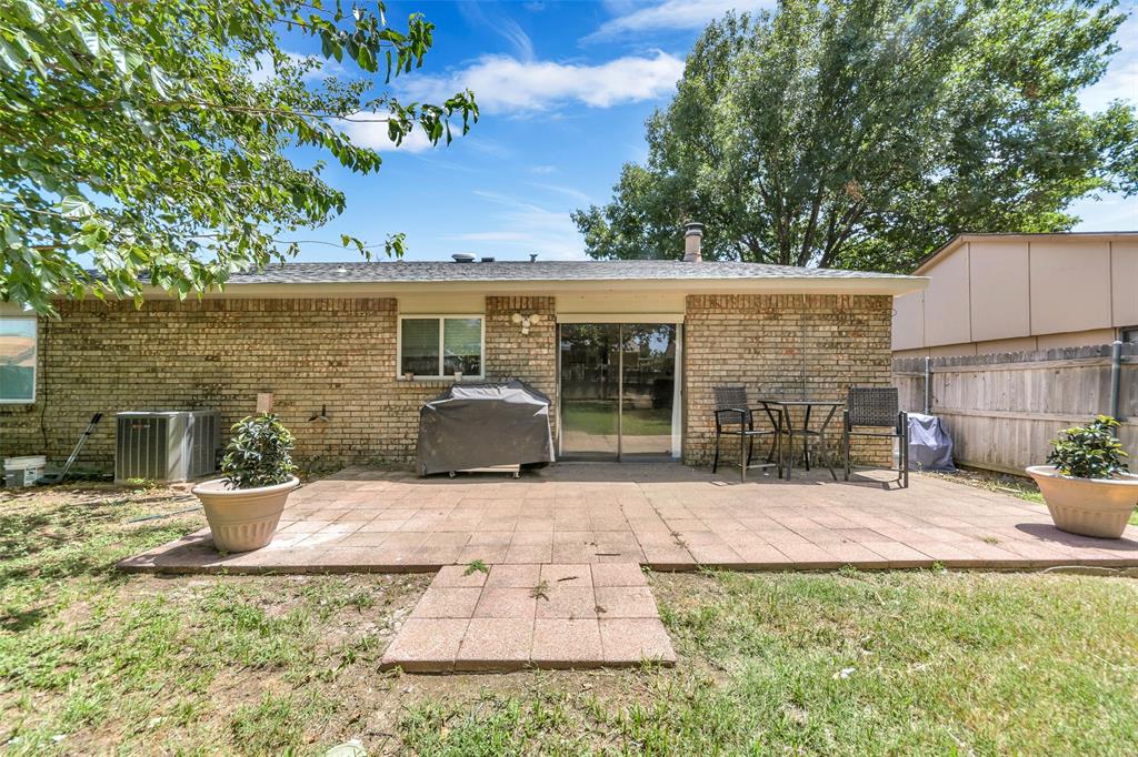 4113 Juneberry Street Fort Worth, TX 76137 - Photo 4 of 36 a view of a backyard with plants and a patio