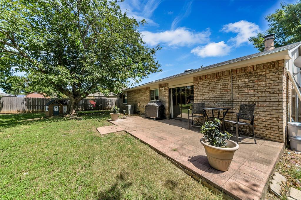 4113 Juneberry Street Fort Worth, TX 76137 - Photo 8 of 36 a view of a backyard with sitting area and garden