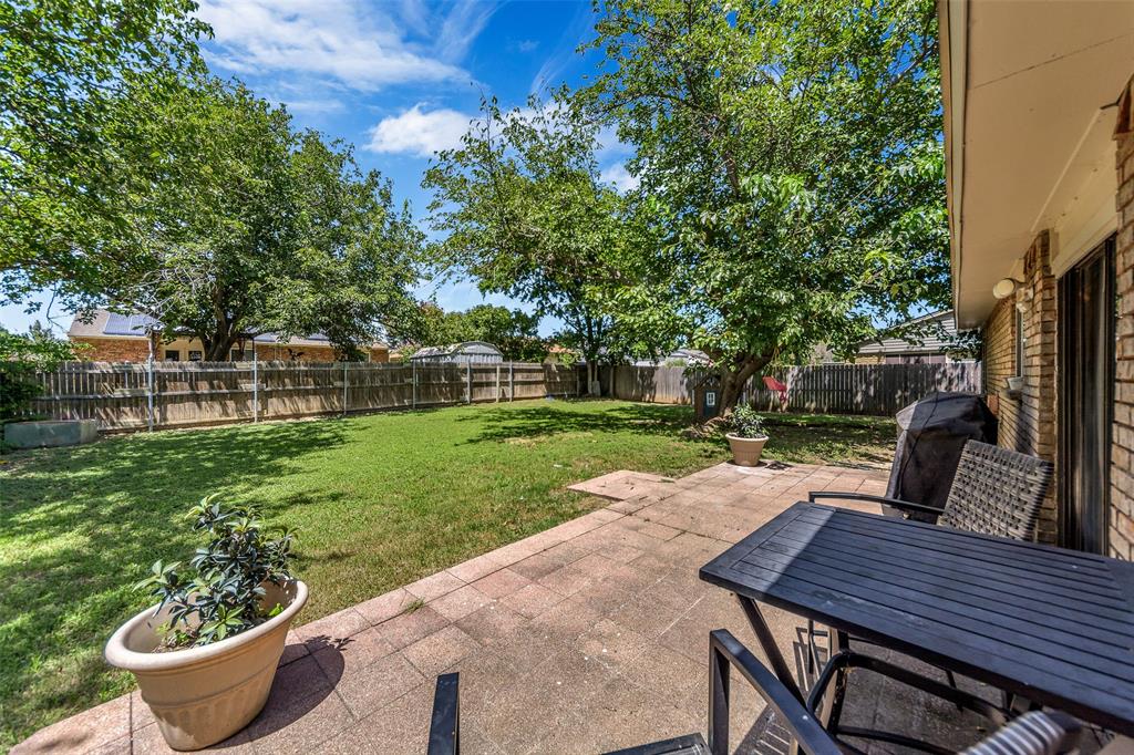4113 Juneberry Street Fort Worth, TX 76137 - Photo 9 of 36 a view of a backyard with sitting area