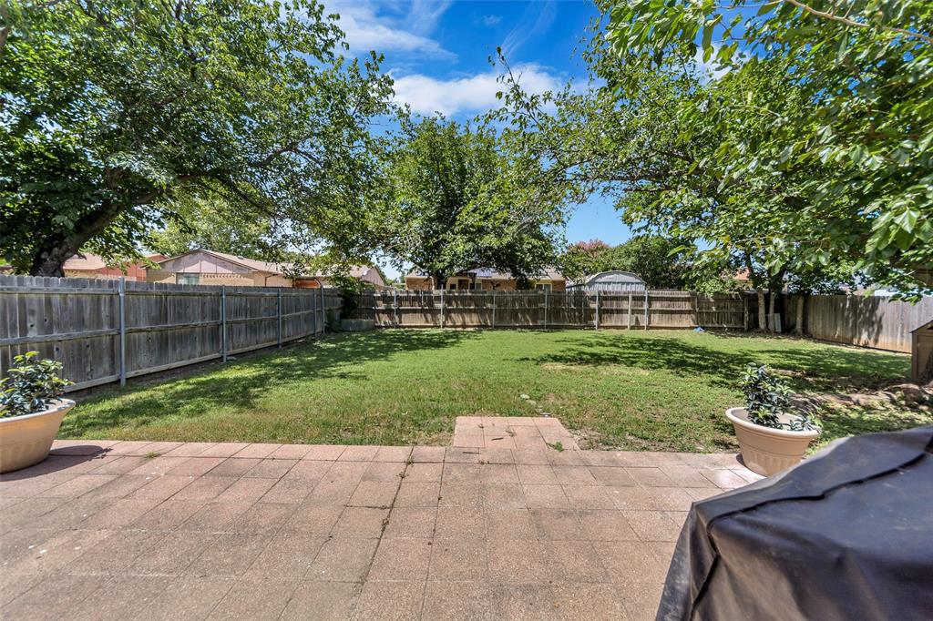 4113 Juneberry Street Fort Worth, TX 76137 - Photo 10 of 36 a view of a garden with a slide