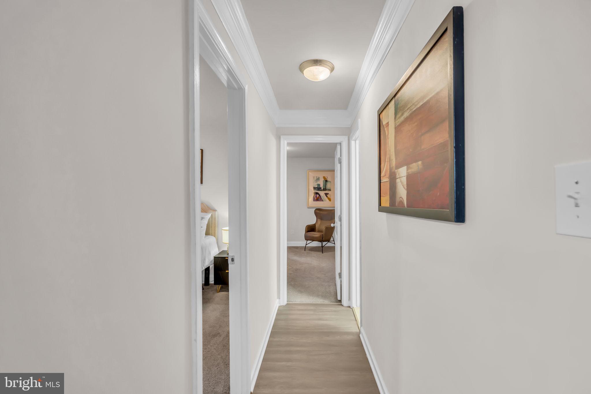 2910 Kings Chapel Road, Unit 5 Falls Church, VA 22042 - Photo 11 of 25 a view of a hallway with wooden shelves