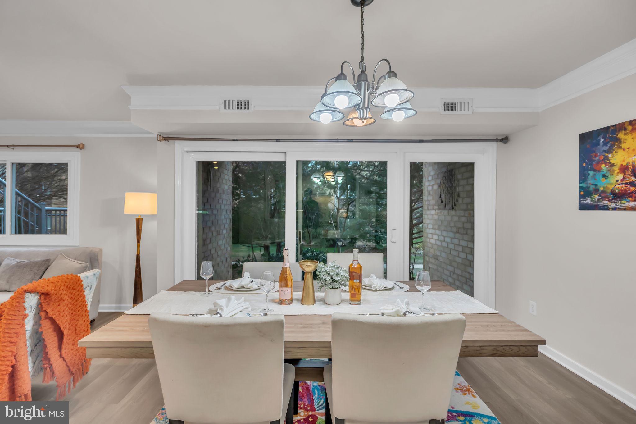 2910 Kings Chapel Road, Unit 5 Falls Church, VA 22042 - Photo 12 of 25 a view of a dining room with furniture wooden floor and chandelier