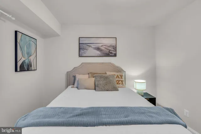 a bedroom with a bed and night stand