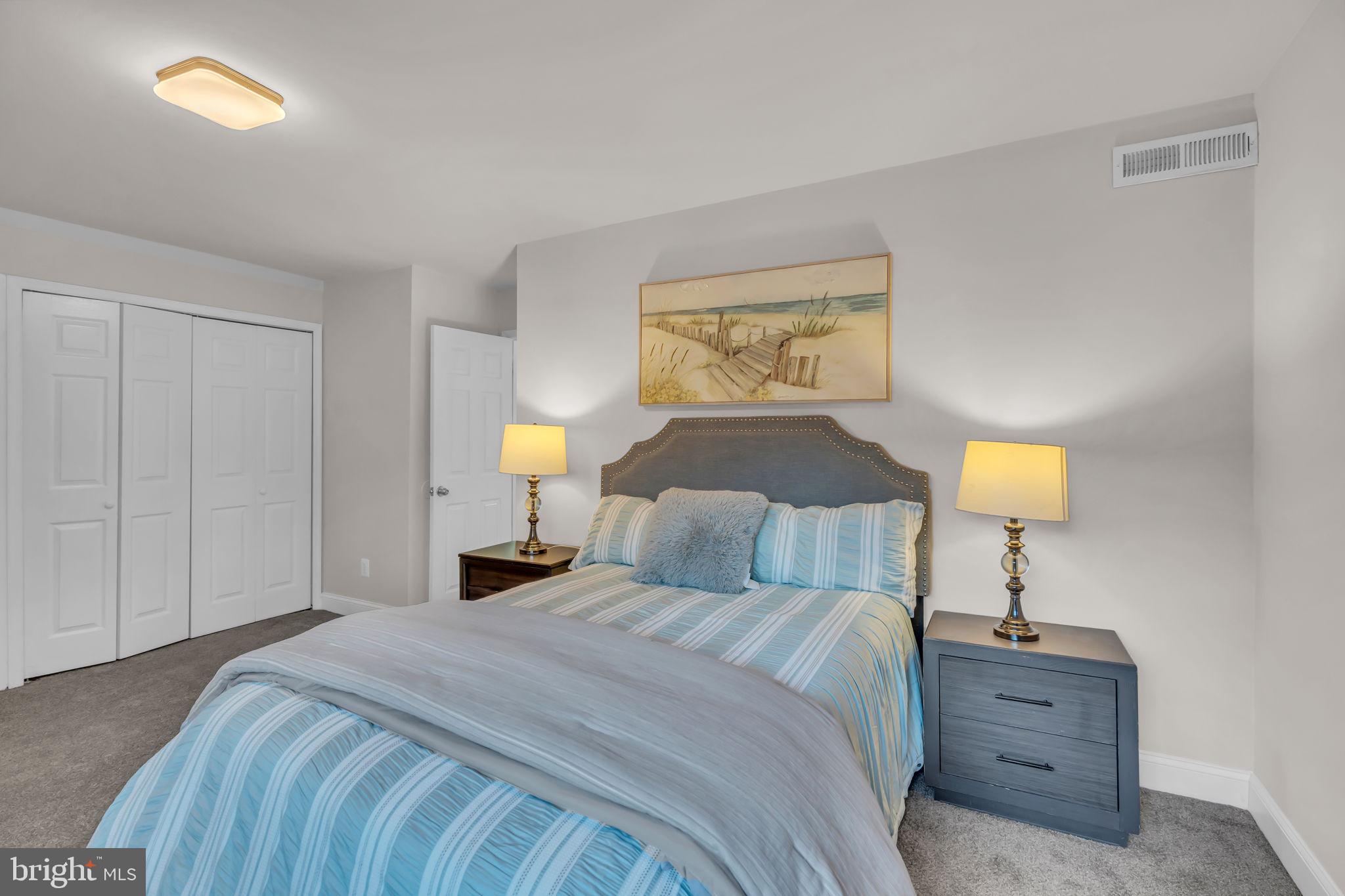 2910 Kings Chapel Road, Unit 5 Falls Church, VA 22042 - Photo 14 of 25 a bedroom with a bed and a lamp