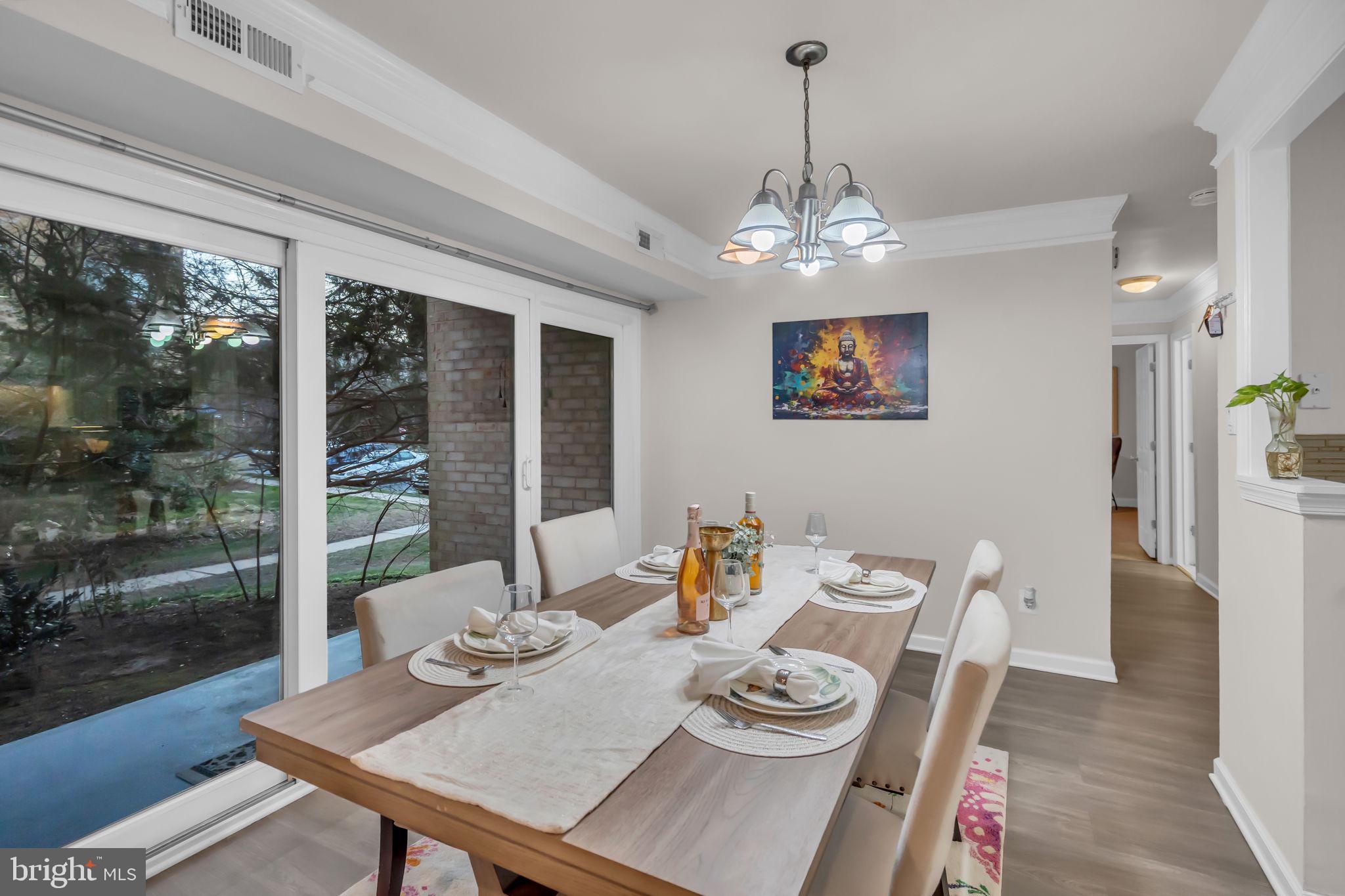 2910 Kings Chapel Road, Unit 5 Falls Church, VA 22042 - Photo 2 of 25 a view of a dining room with furniture window and wooden floor