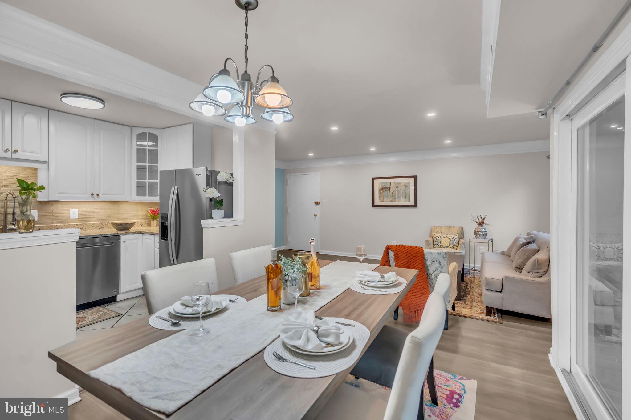 2910 Kings Chapel Road, Unit 5 Falls Church, VA 22042 - Photo 3 of 25 a living room with dining room and kitchen view