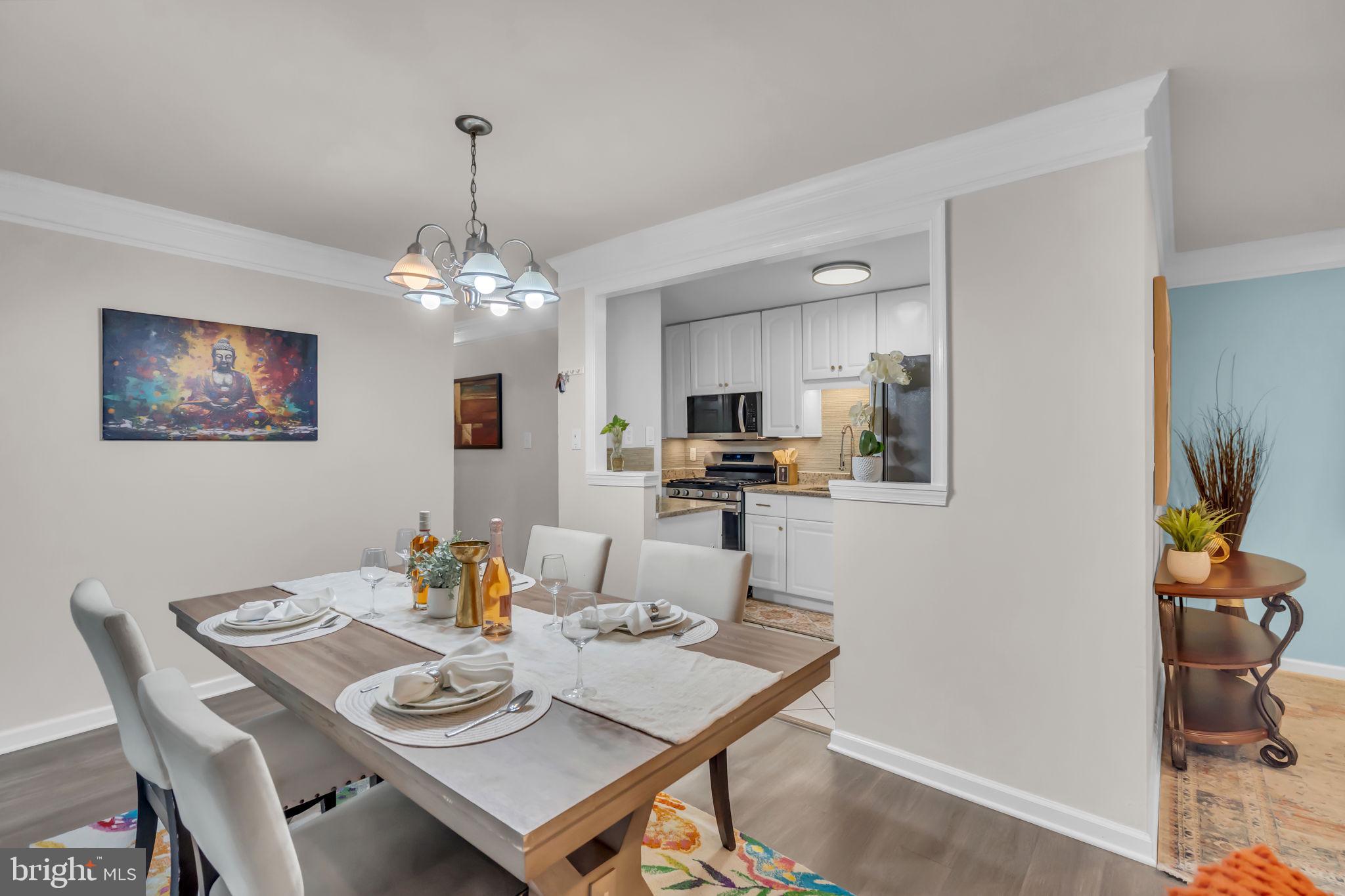 2910 Kings Chapel Road, Unit 5 Falls Church, VA 22042 - Photo 4 of 25 a view of a dining room with furniture and chandelier