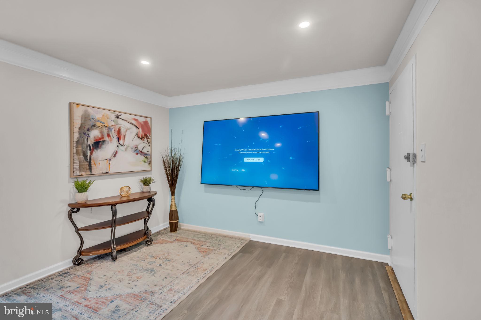 2910 Kings Chapel Road, Unit 5 Falls Church, VA 22042 - Photo 6 of 25 a view of a room with wooden floor and bench
