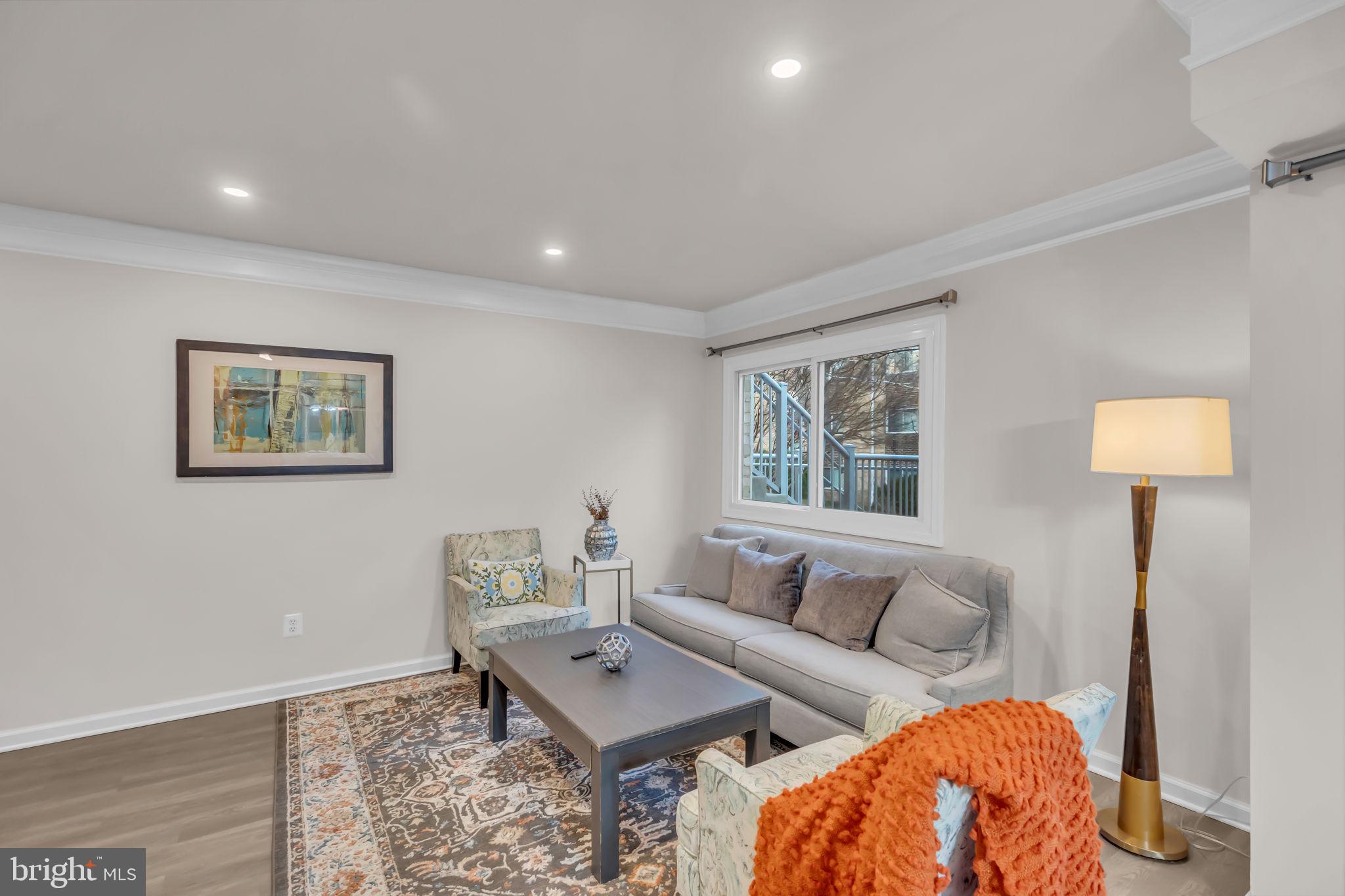 2910 Kings Chapel Road, Unit 5 Falls Church, VA 22042 - Photo 7 of 25 a living room with furniture and a lamp