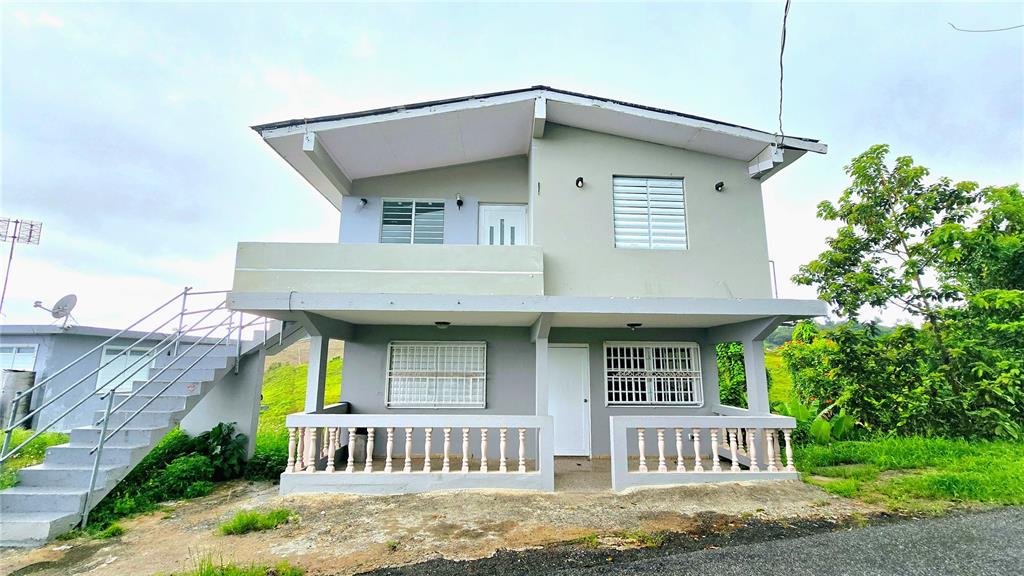 749 Sector La Barranquitas, PR 00794 - Photo 1 of 1 a front view of a house with garden