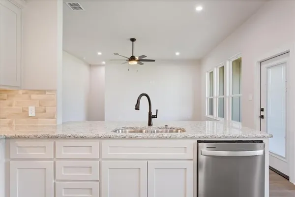 a bathroom with a sink double vanity and a mirror