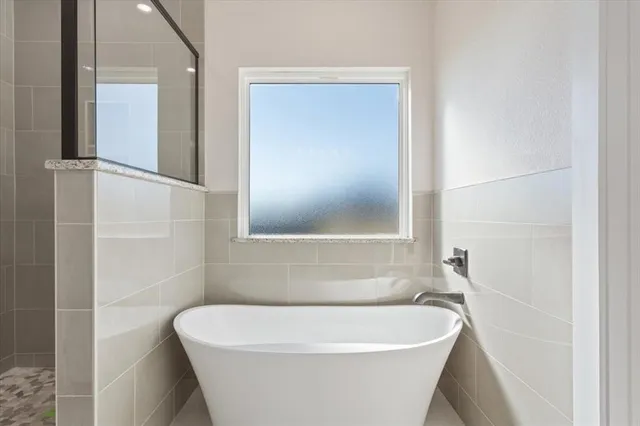 a white bath tub sitting in a bathroom