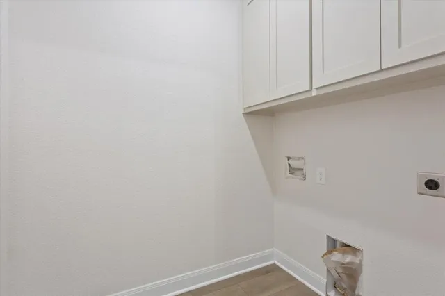 a view of storage and utility room with window