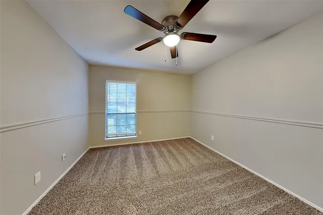 a large white kitchen with a large window