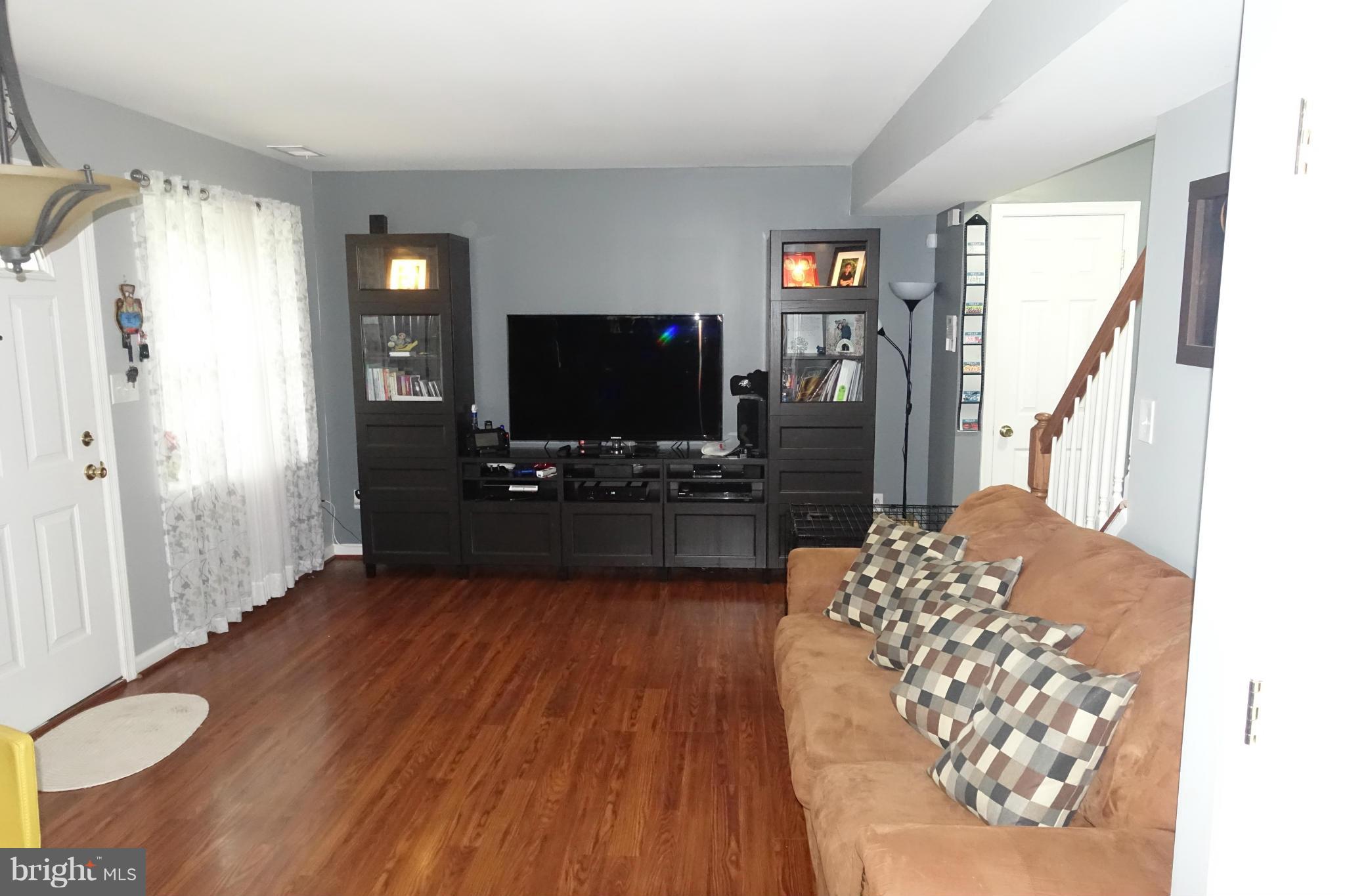 2019 Ray Leonard Road Landover, MD 20785 - Photo 3 of 19 a living room with furniture and a flat screen tv