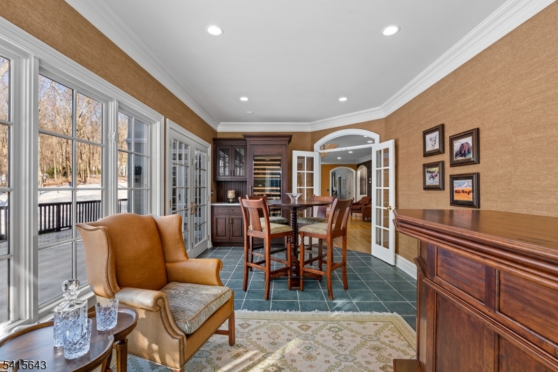 7 Timber Ridge Road Far Hills, NJ 07931 - Photo 18 of 48 a living room with furniture a rug potted plant and a large window