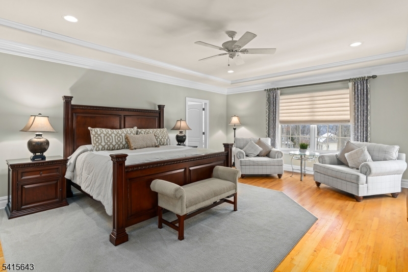 7 Timber Ridge Road Far Hills, NJ 07931 - Photo 24 of 48 a spacious bedroom with a bed a couch and a couch