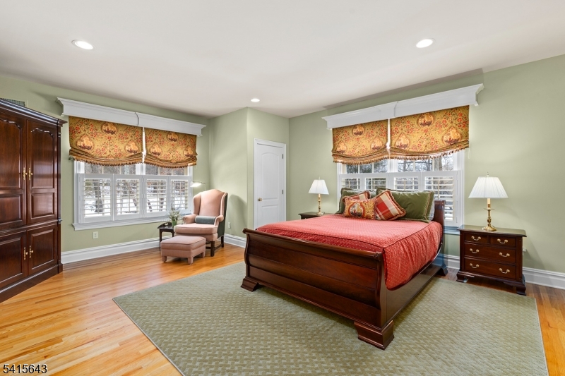 7 Timber Ridge Road Far Hills, NJ 07931 - Photo 33 of 48 a bedroom with a bed and wooden floor