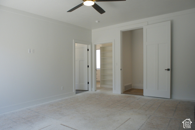 3504 North Sun Dancer Loop Logan, UT 84341 - Photo 31 of 59 Recessed lighting, ceiling fan, built-in shelving, paneled interior doors, and matte black hardware