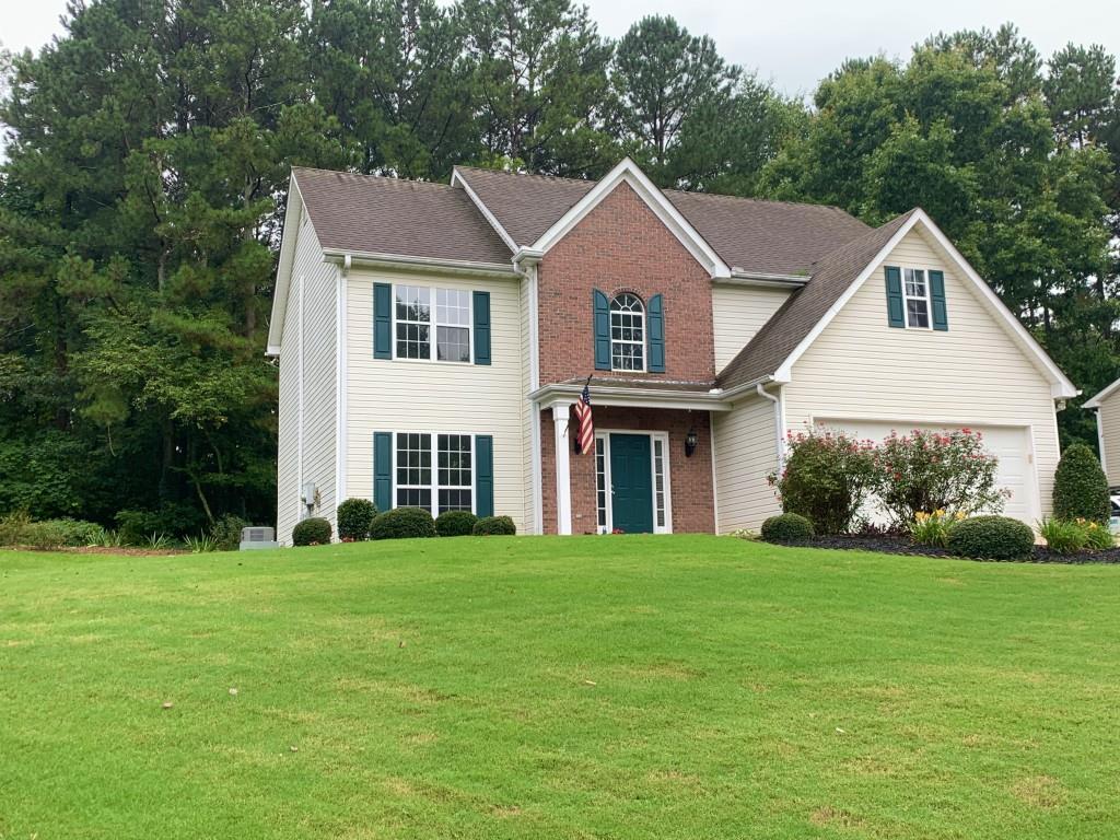3960 Starr Creek Road Cumming, GA 30028 - Photo 1 of 1 a front view of a house with a yard