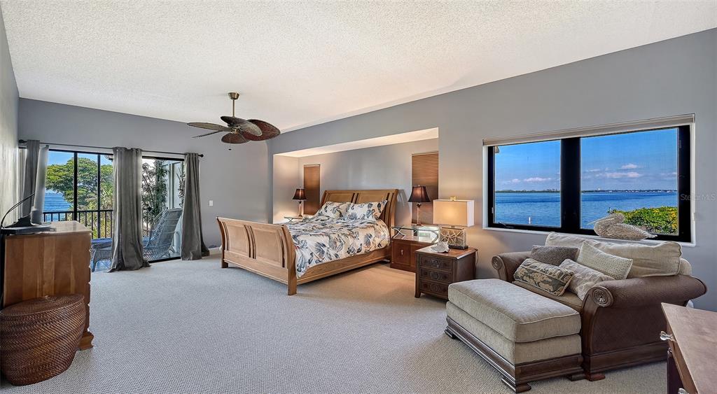 3850 Mariners Walk, Unit 714 Cortez, FL 34215 - Photo 14 of 59 a spacious bedroom with bed and a large window