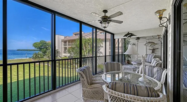 a view of a house with pool and chairs