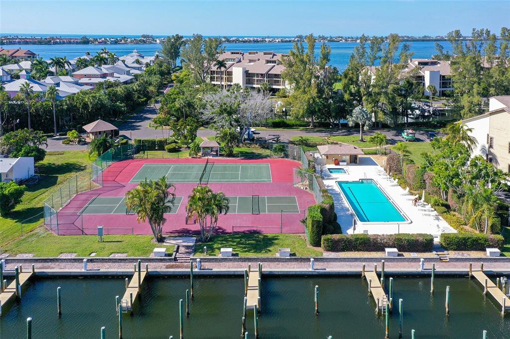 3850 Mariners Walk, Unit 714 Cortez, FL 34215 - Photo 28 of 59 an aerial view of a houses with swimming pool and outdoor seating