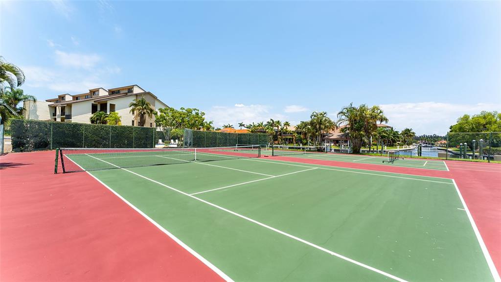 3850 Mariners Walk, Unit 714 Cortez, FL 34215 - Photo 31 of 59 a view of a tennis court