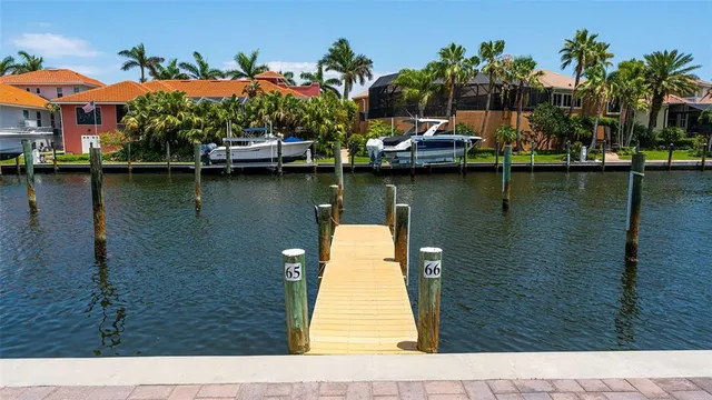 a view of a dinning table and chairs in patio of the house