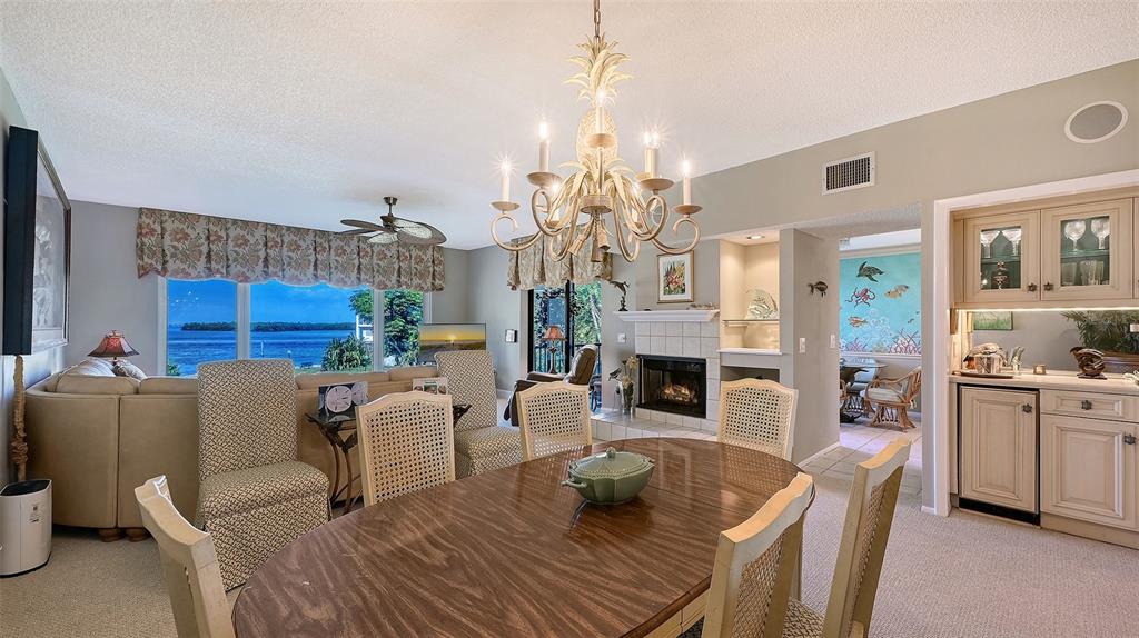 3850 Mariners Walk, Unit 714 Cortez, FL 34215 - Photo 5 of 59 a living room with furniture and a chandelier