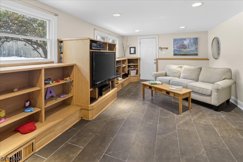 947 Cherry Hill Road Princeton, NJ 08540 - Photo 16 of 45 a living room with furniture cabinets and a flat screen tv