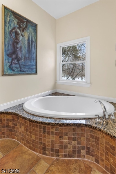 947 Cherry Hill Road Princeton, NJ 08540 - Photo 22 of 45 a view of a bathtub in a bathroom