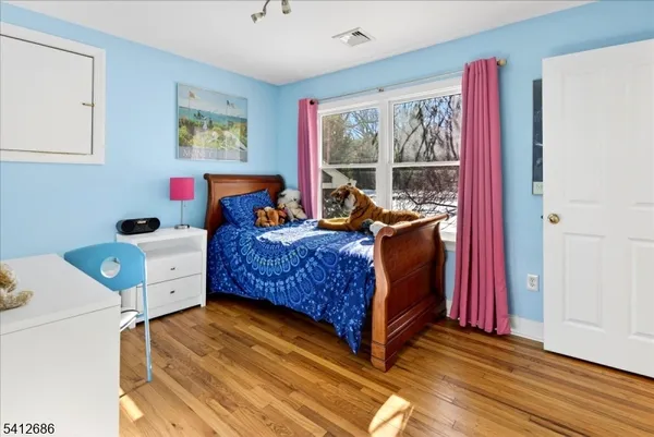 a bed room with a bed and a window