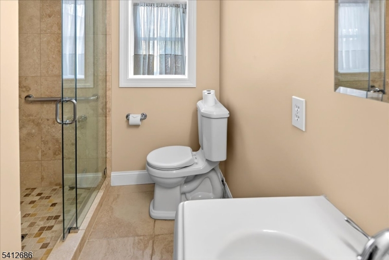 947 Cherry Hill Road Princeton, NJ 08540 - Photo 28 of 45 a bathroom with a toilet and a shower