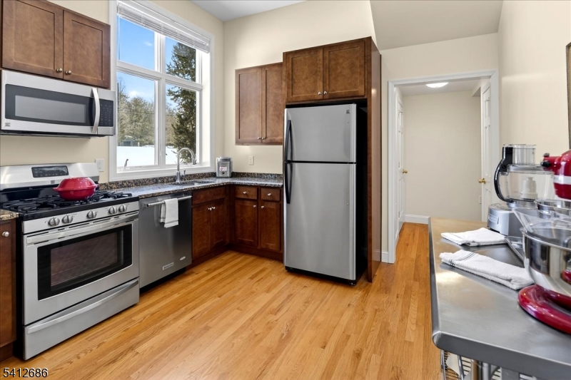 947 Cherry Hill Road Princeton, NJ 08540 - Photo 35 of 45 a kitchen with stainless steel appliances granite countertop a refrigerator stove and sink