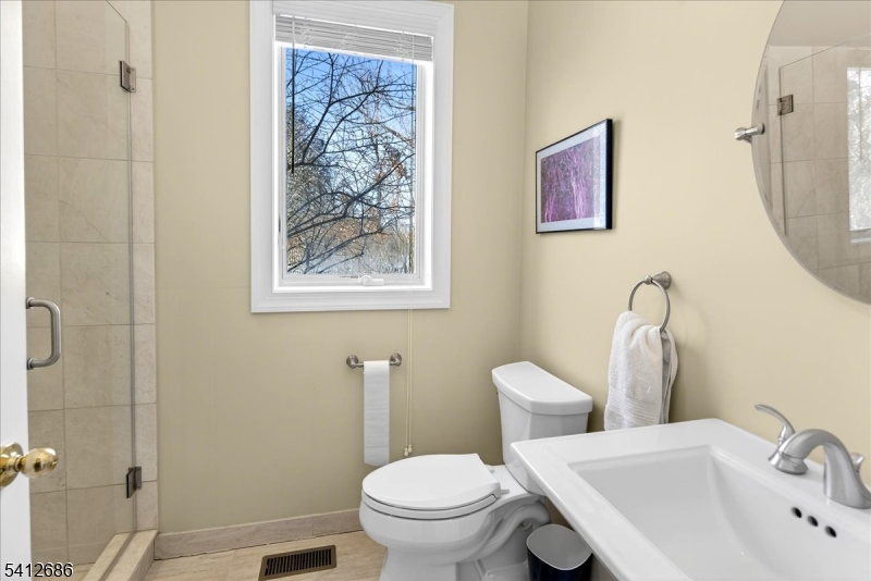 947 Cherry Hill Road Princeton, NJ 08540 - Photo 36 of 45 a bathroom with a toilet sink and mirror