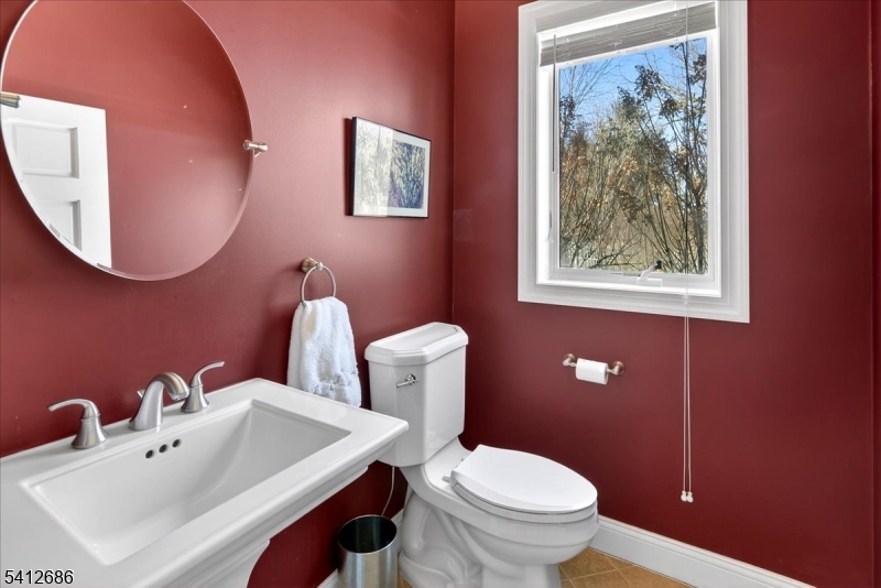 947 Cherry Hill Road Princeton, NJ 08540 - Photo 37 of 45 a bathroom with a toilet sink and mirror