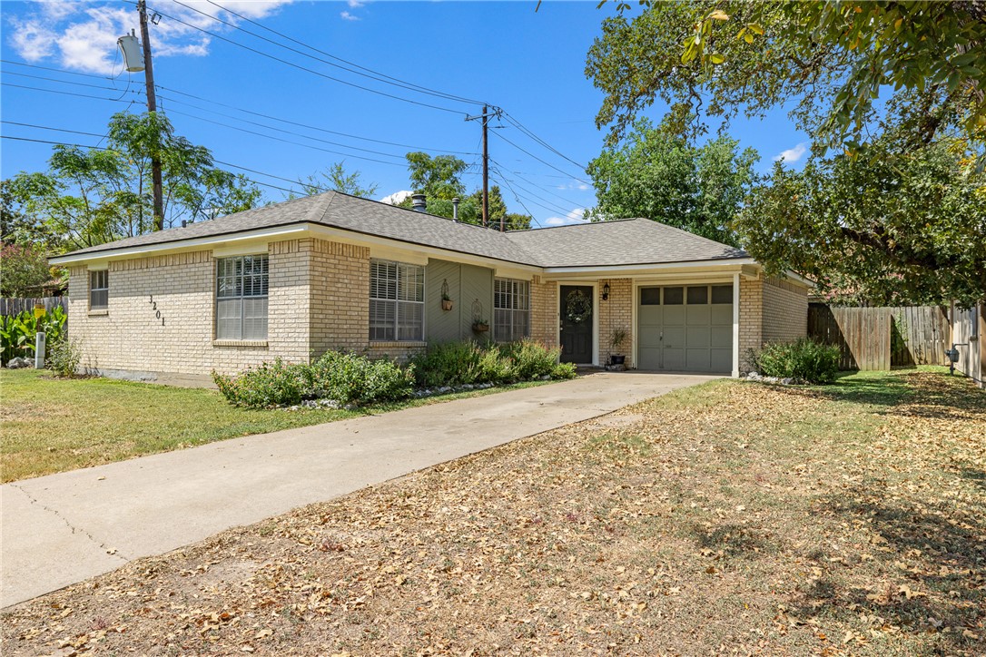 3201 Wildlife Circle Bryan, TX 77802 - Photo 1 of 1 a front view of a house with a garden