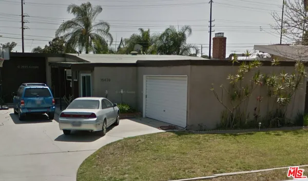 a car parked in front of a house