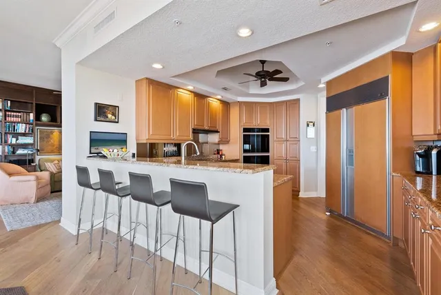 a balcony with furniture and city view
