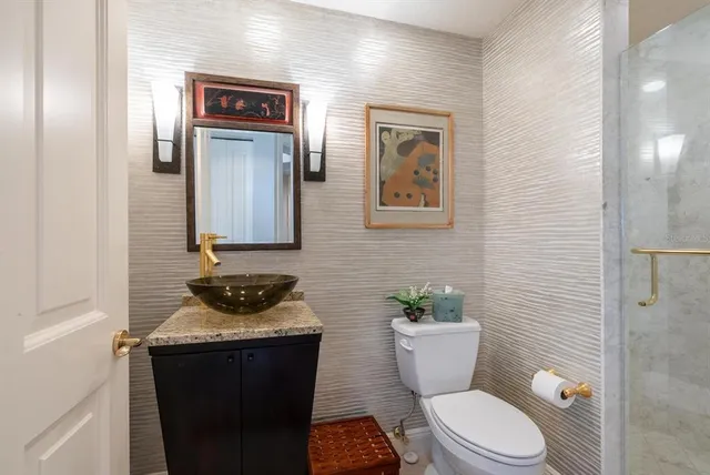 a view of a balcony with chairs