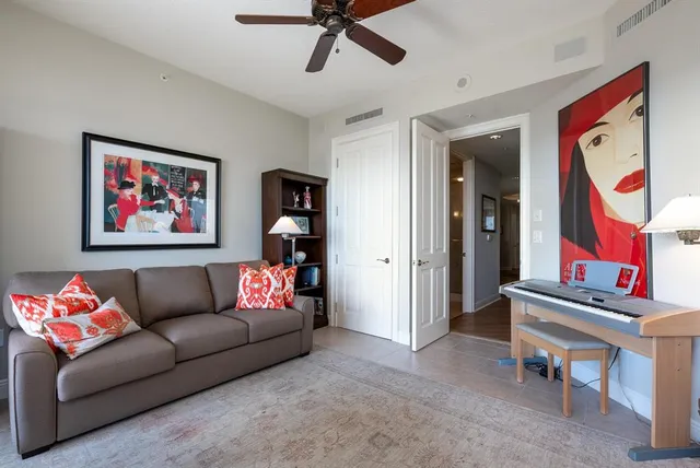 a lobby with furniture and a chandelier
