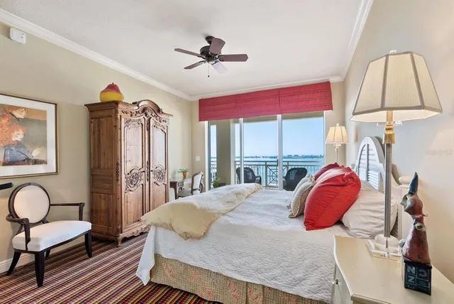 a living room with furniture a chandelier and a dining table