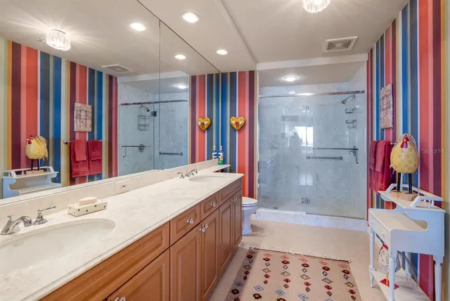 a dining room with furniture a chandelier and window