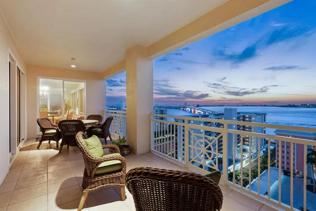 a building outdoor space with patio furniture and potted plants