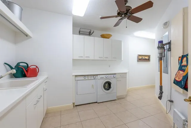 a group of people sitting in front of retail shops