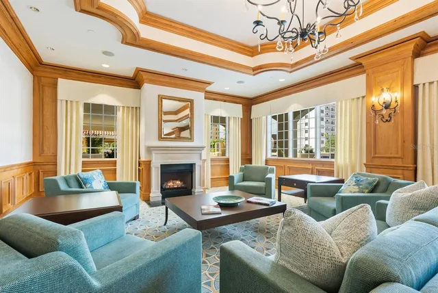 a view of a lake with a table and chairs